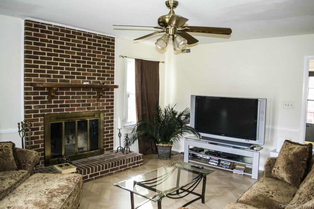 8710 Houston Ridge Road, Unit 21 Charlotte, NC 28277 - Photo 8 of 22 a living room with furniture and a flat screen tv