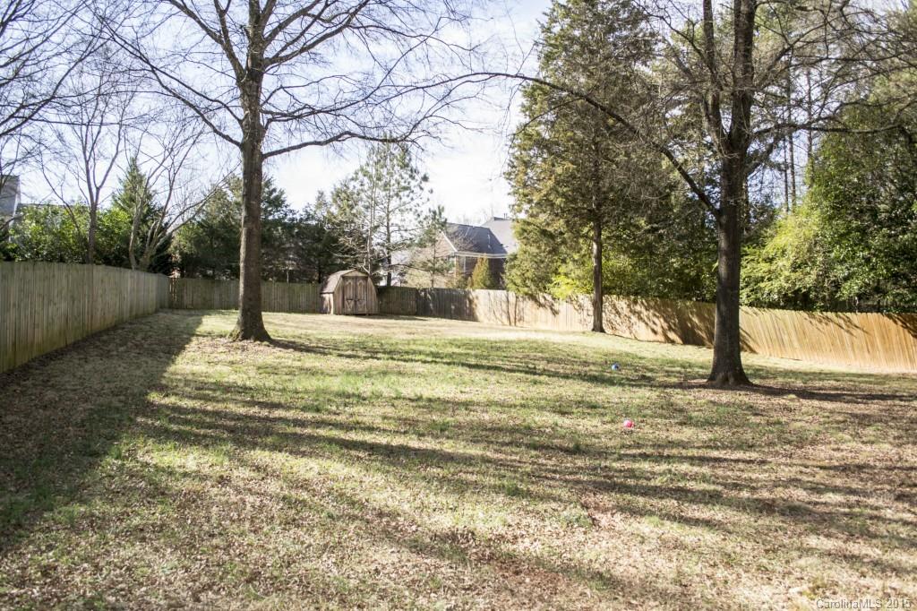 8710 Houston Ridge Road, Unit 21 Charlotte, NC 28277 - Photo 9 of 22 a view of a yard with large trees