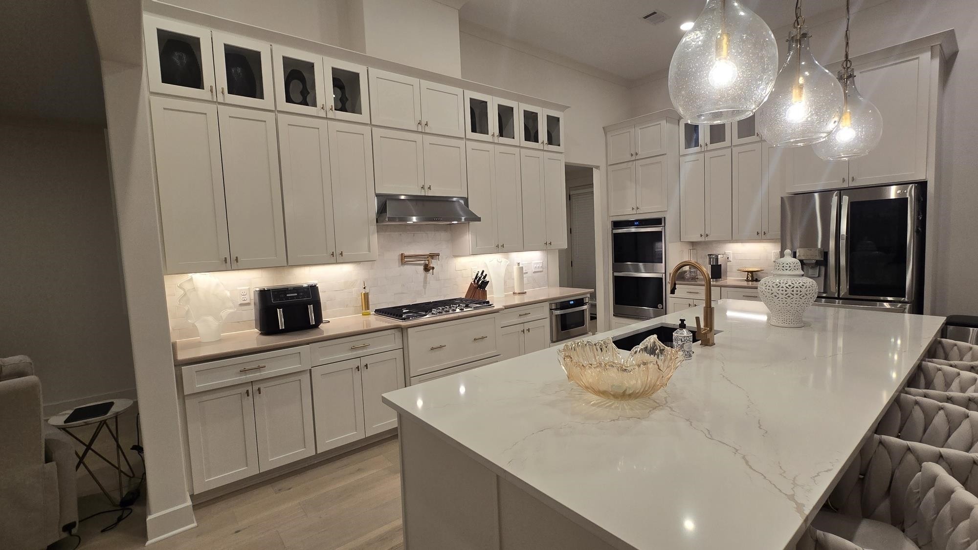 11200 Shelby Post Road Collierville, TN 38017 - Photo 16 of 29 a kitchen with a sink a stove and chairs