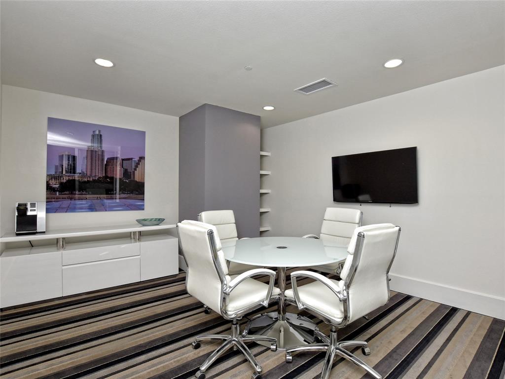 1900 Barton Springs Road, Unit 5009 Austin, TX 78704 - Photo 32 of 35 A well-appointed meeting space features recessed lighting and stylish striped flooring.