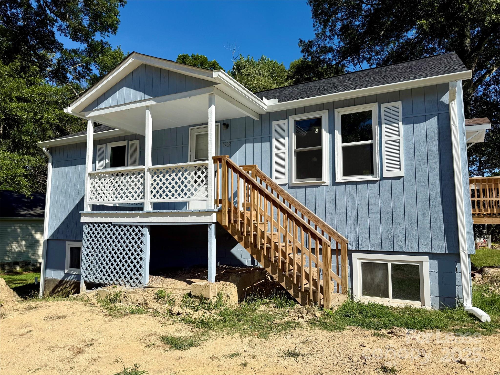 1902 West 5th Avenue, Unit B Gastonia, NC 28052 - Photo 1 of 25 a front view of a house with a yard