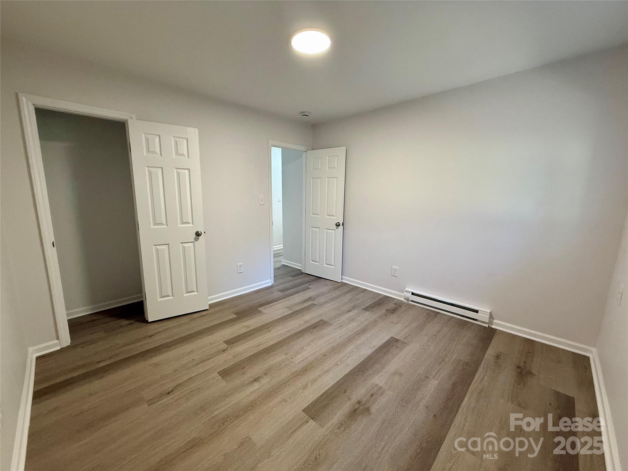 1902 West 5th Avenue, Unit B Gastonia, NC 28052 - Photo 14 of 25 a view of a room with wooden floor