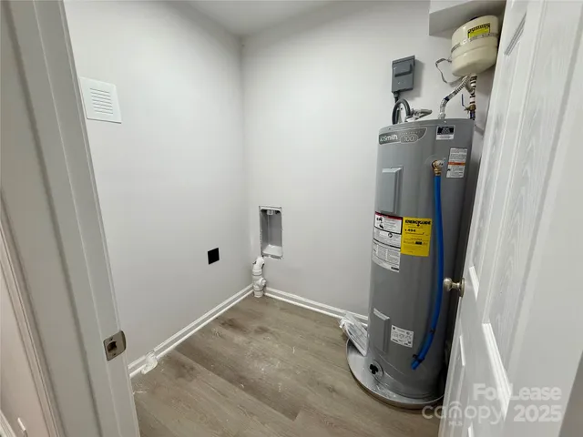 a view of door space with wooden cabinet