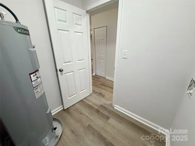 a kitchen with granite countertop a sink stove and refrigerator