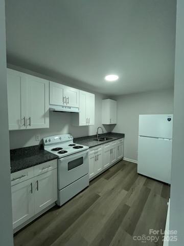 1902 West 5th Avenue, Unit B Gastonia, NC 28052 - Photo 25 of 25 a kitchen with a white cabinets and white appliances