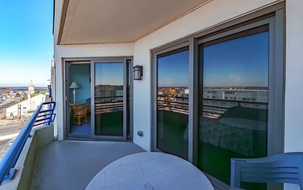 a lobby with furniture and floor to ceiling window