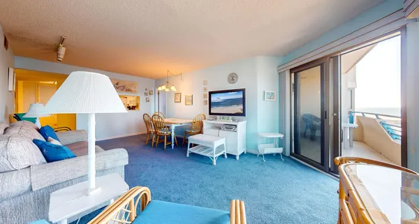 a bedroom with two beds and lamp