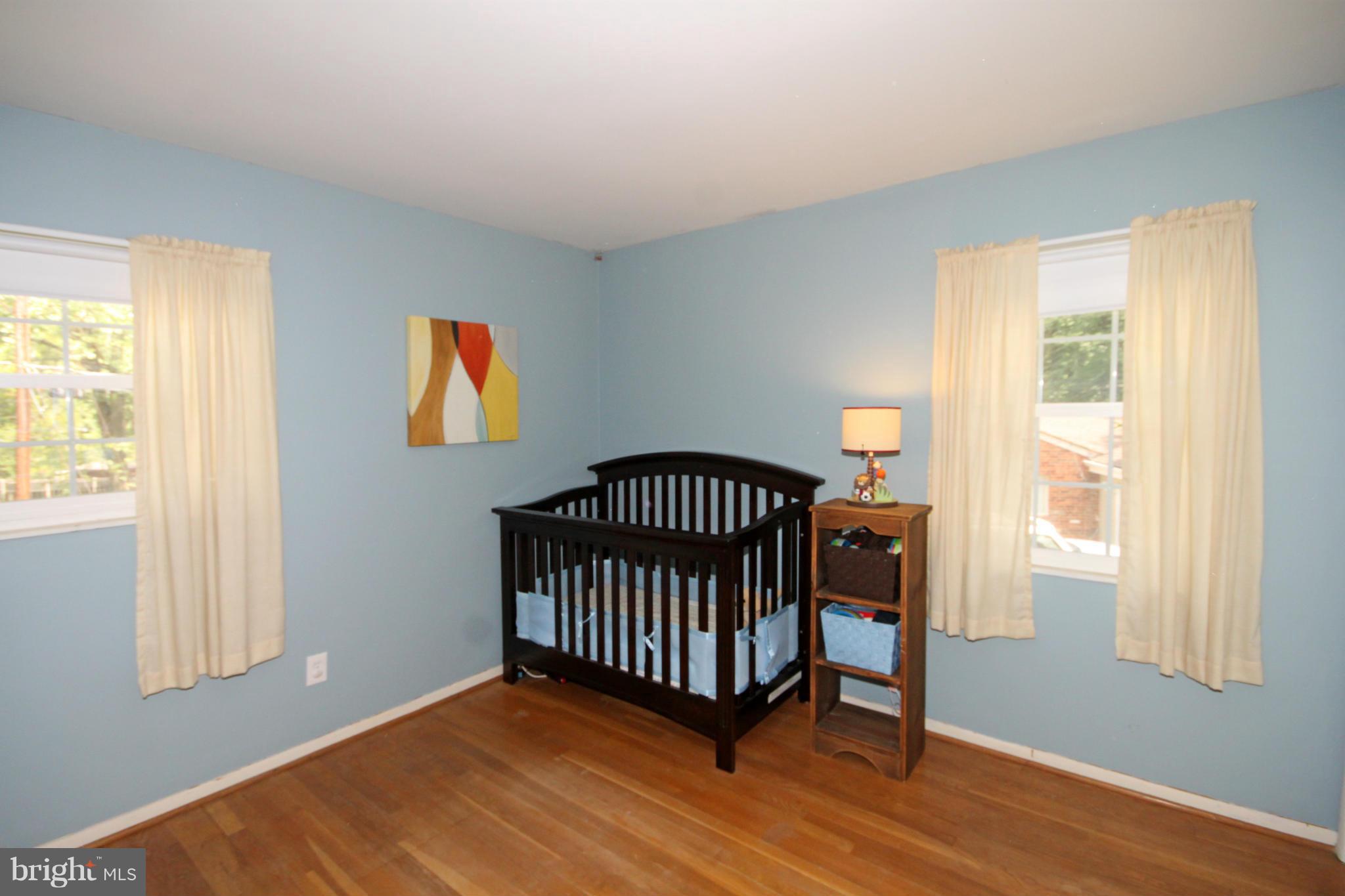 7531 Axton Street Springfield, VA 22151 - Photo 14 of 26 a view of a room with a window and wooden floor