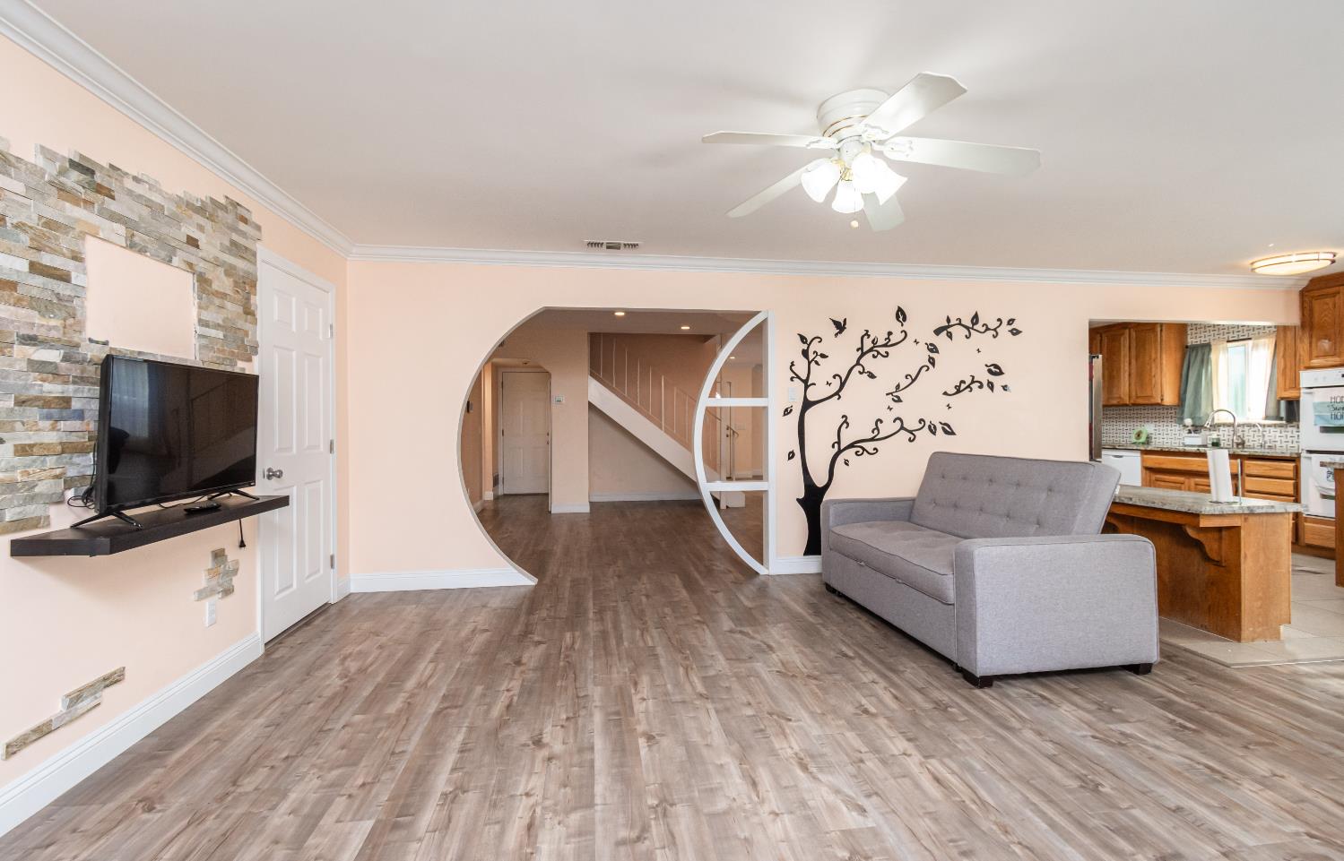 6851 Aleta Way Sacramento, CA 95842 - Photo 14 of 45 a living room with furniture and a flat screen tv