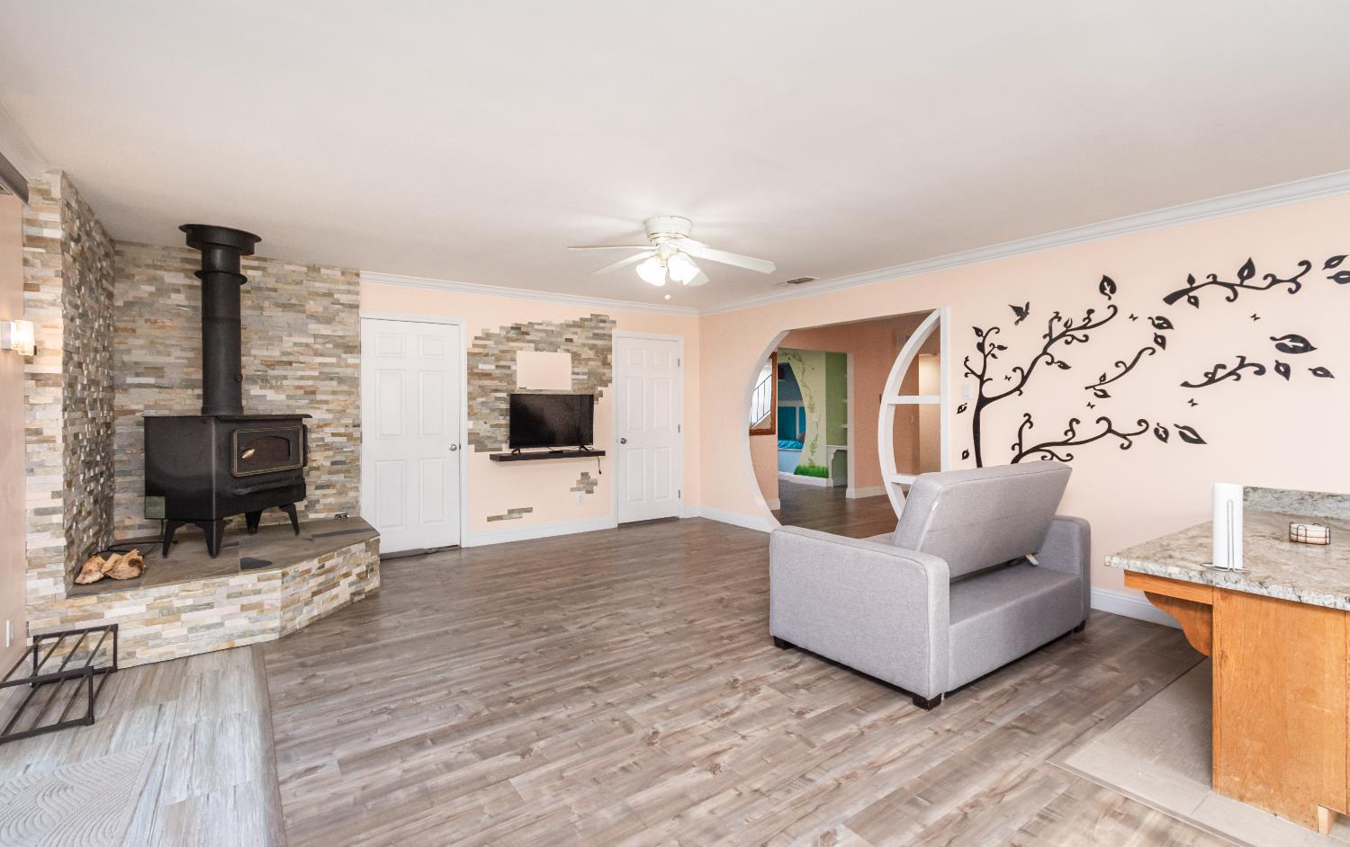 6851 Aleta Way Sacramento, CA 95842 - Photo 16 of 45 a living room with furniture and a flat screen tv