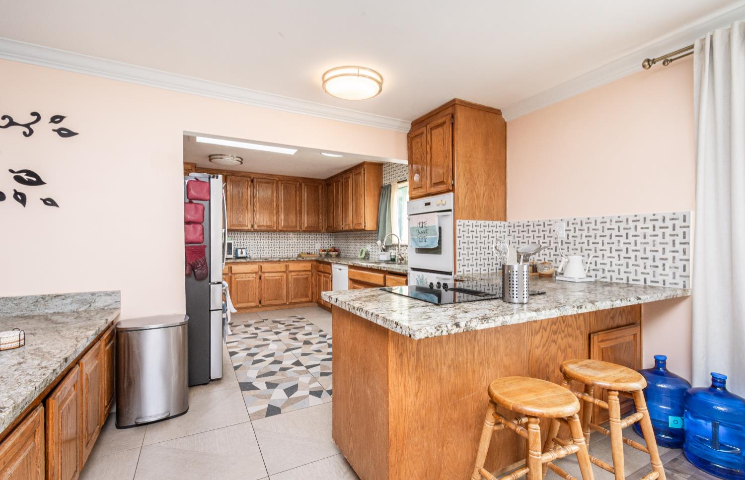 6851 Aleta Way Sacramento, CA 95842 - Photo 19 of 45 a kitchen with stainless steel appliances granite countertop a sink stove and refrigerator