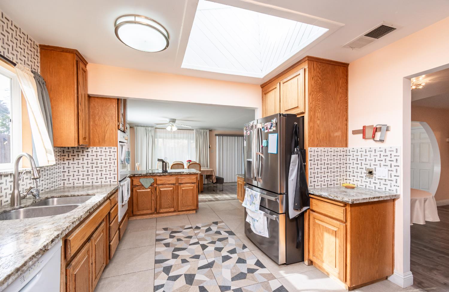 6851 Aleta Way Sacramento, CA 95842 - Photo 21 of 45 a kitchen with stainless steel appliances granite countertop a refrigerator and a sink