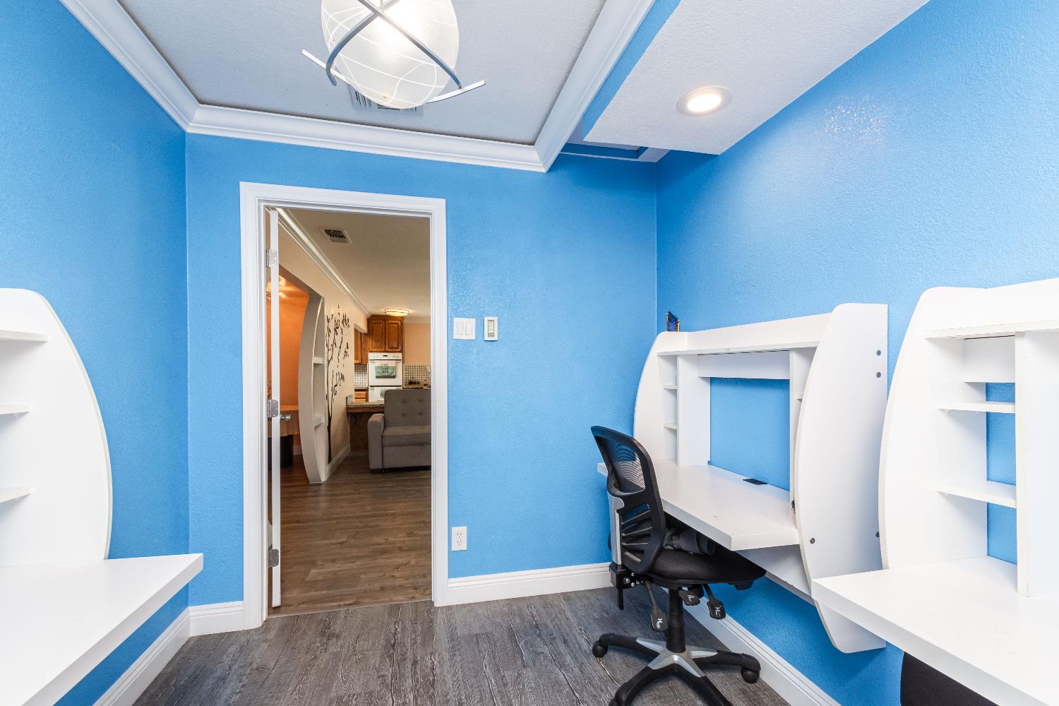 6851 Aleta Way Sacramento, CA 95842 - Photo 24 of 45 a workspace with furniture and wooden floor