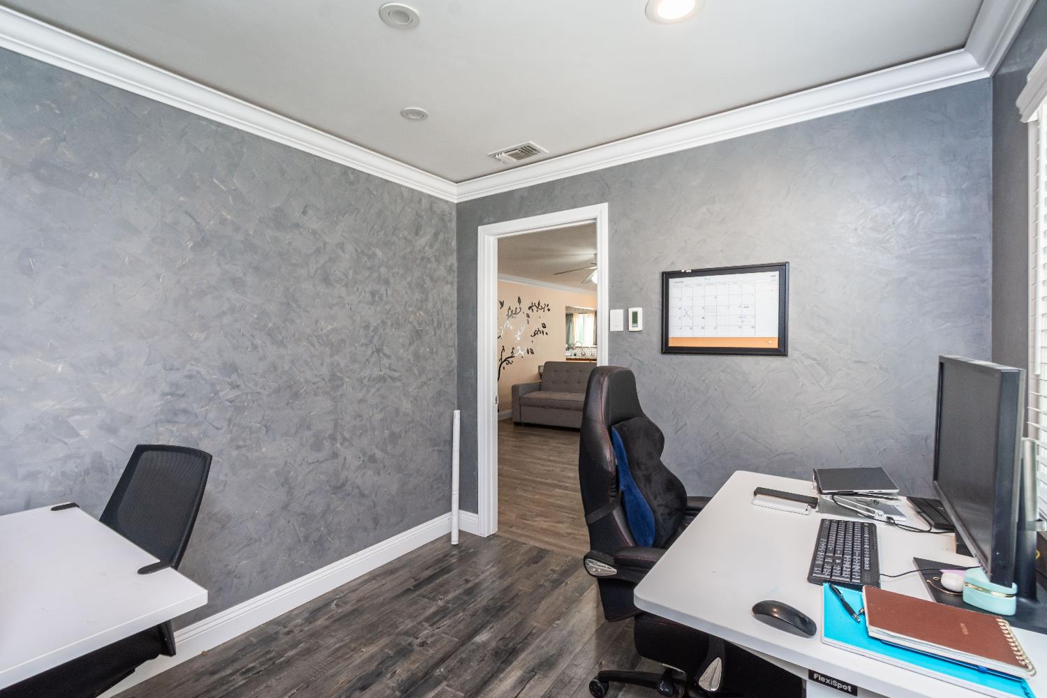 6851 Aleta Way Sacramento, CA 95842 - Photo 29 of 45 a workspace with furniture and wooden floor