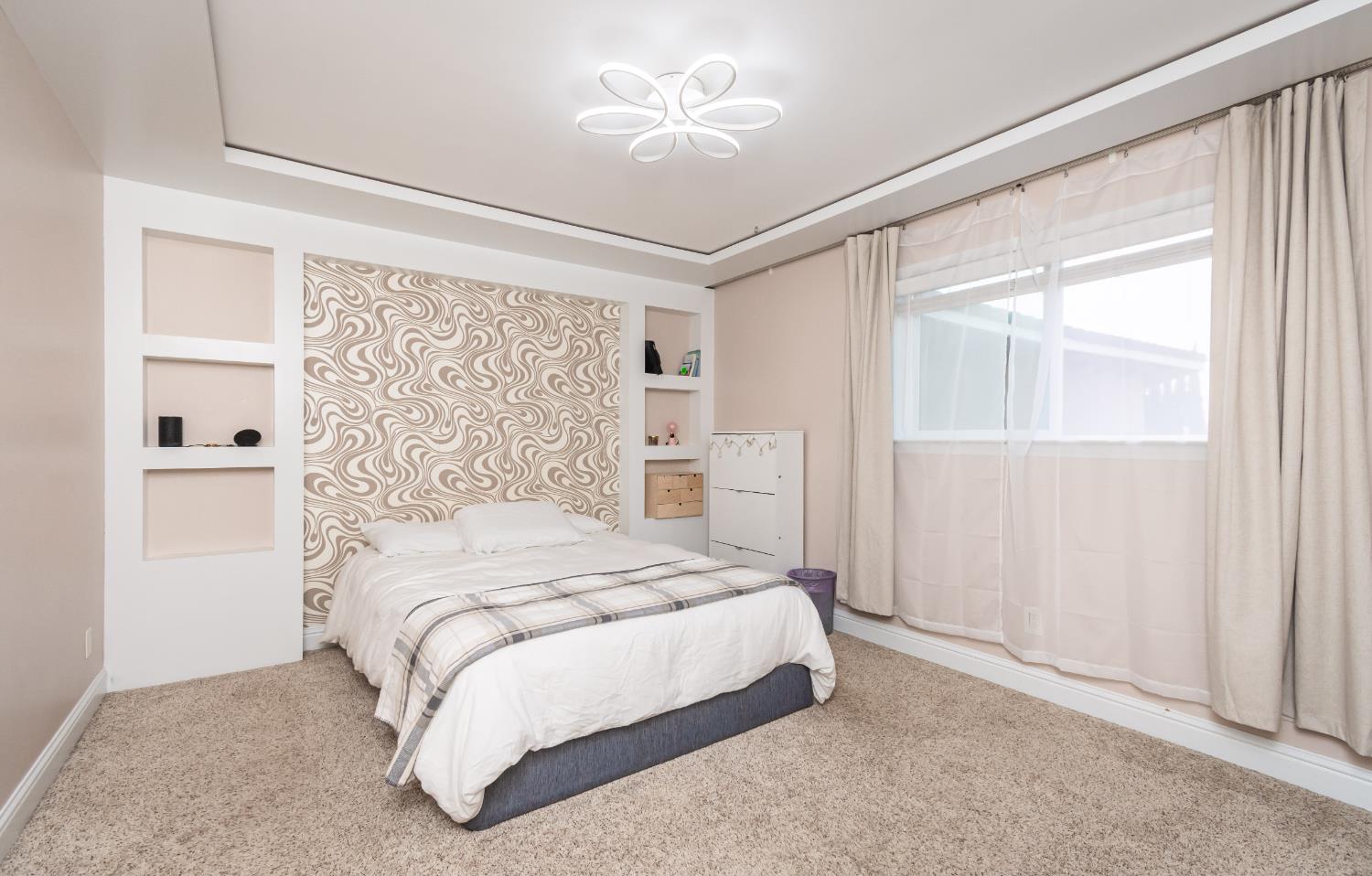 6851 Aleta Way Sacramento, CA 95842 - Photo 30 of 45 a bedroom with a bed and a window