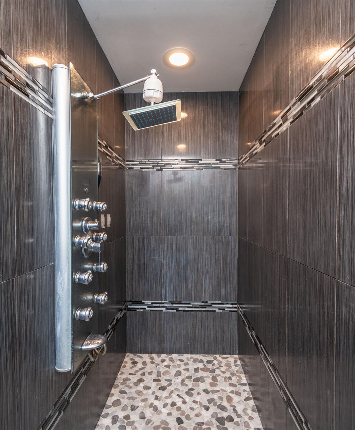 6851 Aleta Way Sacramento, CA 95842 - Photo 33 of 45 a bathroom with a shower and a sink