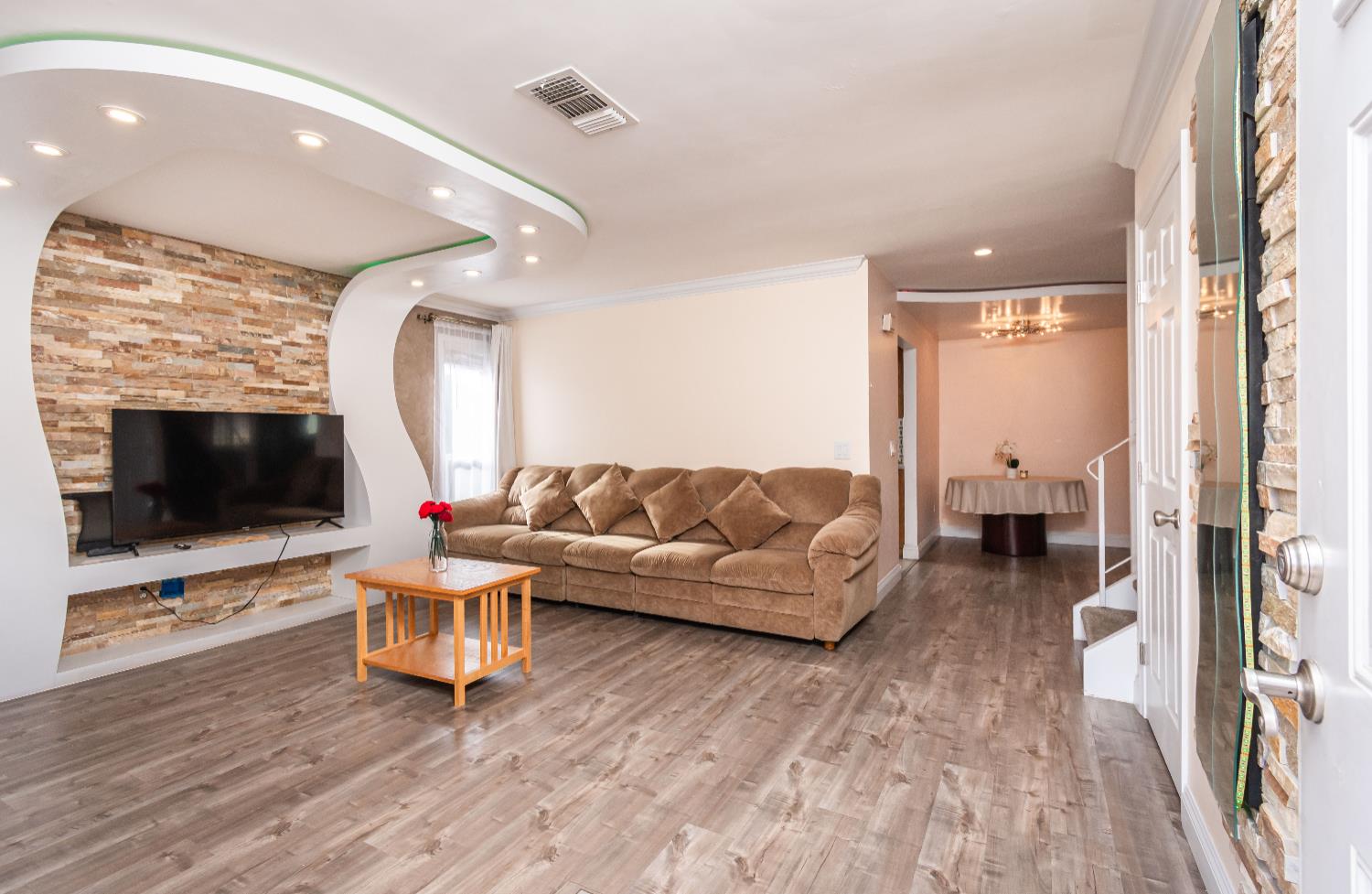 6851 Aleta Way Sacramento, CA 95842 - Photo 4 of 45 a living room with furniture and a flat screen tv