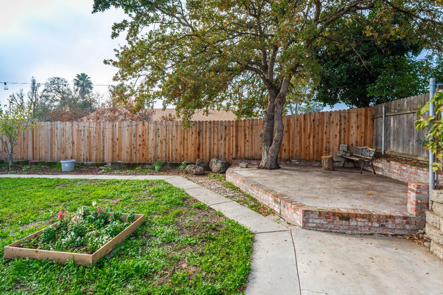 6851 Aleta Way Sacramento, CA 95842 - Photo 42 of 45 a view of a backyard with wooden fence