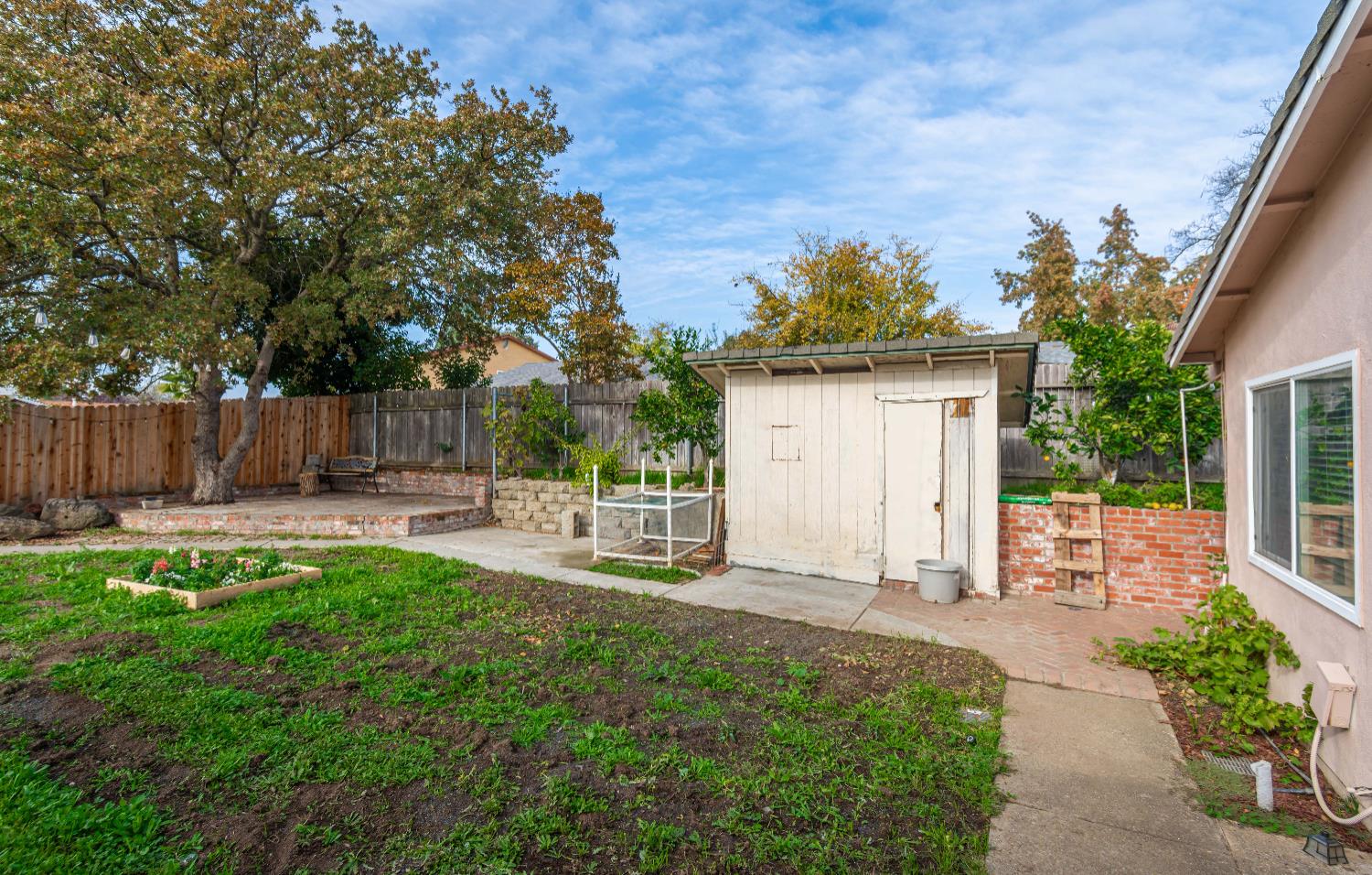 6851 Aleta Way Sacramento, CA 95842 - Photo 43 of 45 a view of a chair and table in backyard of the house