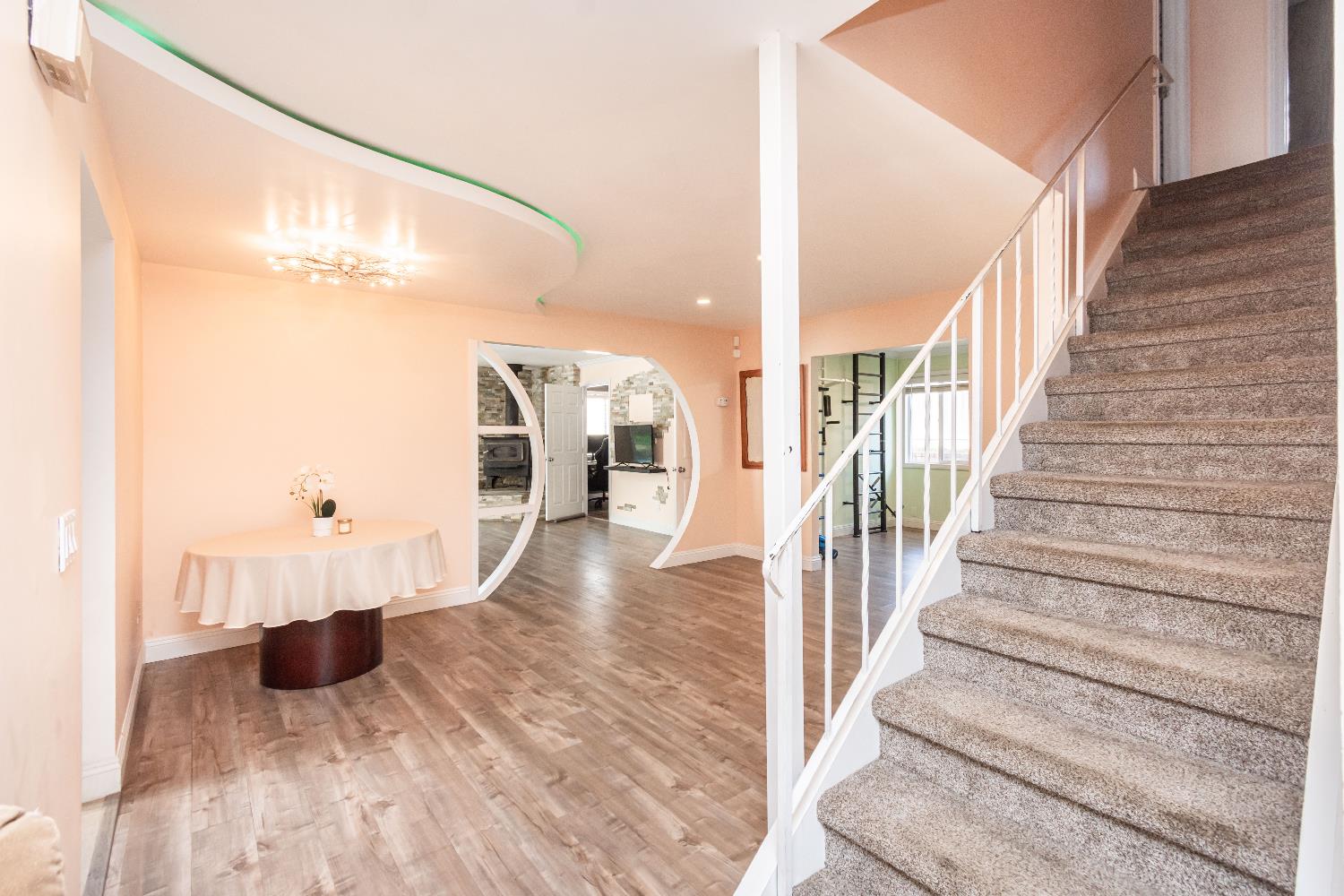 6851 Aleta Way Sacramento, CA 95842 - Photo 7 of 45 a view of entryway and hall with wooden floor