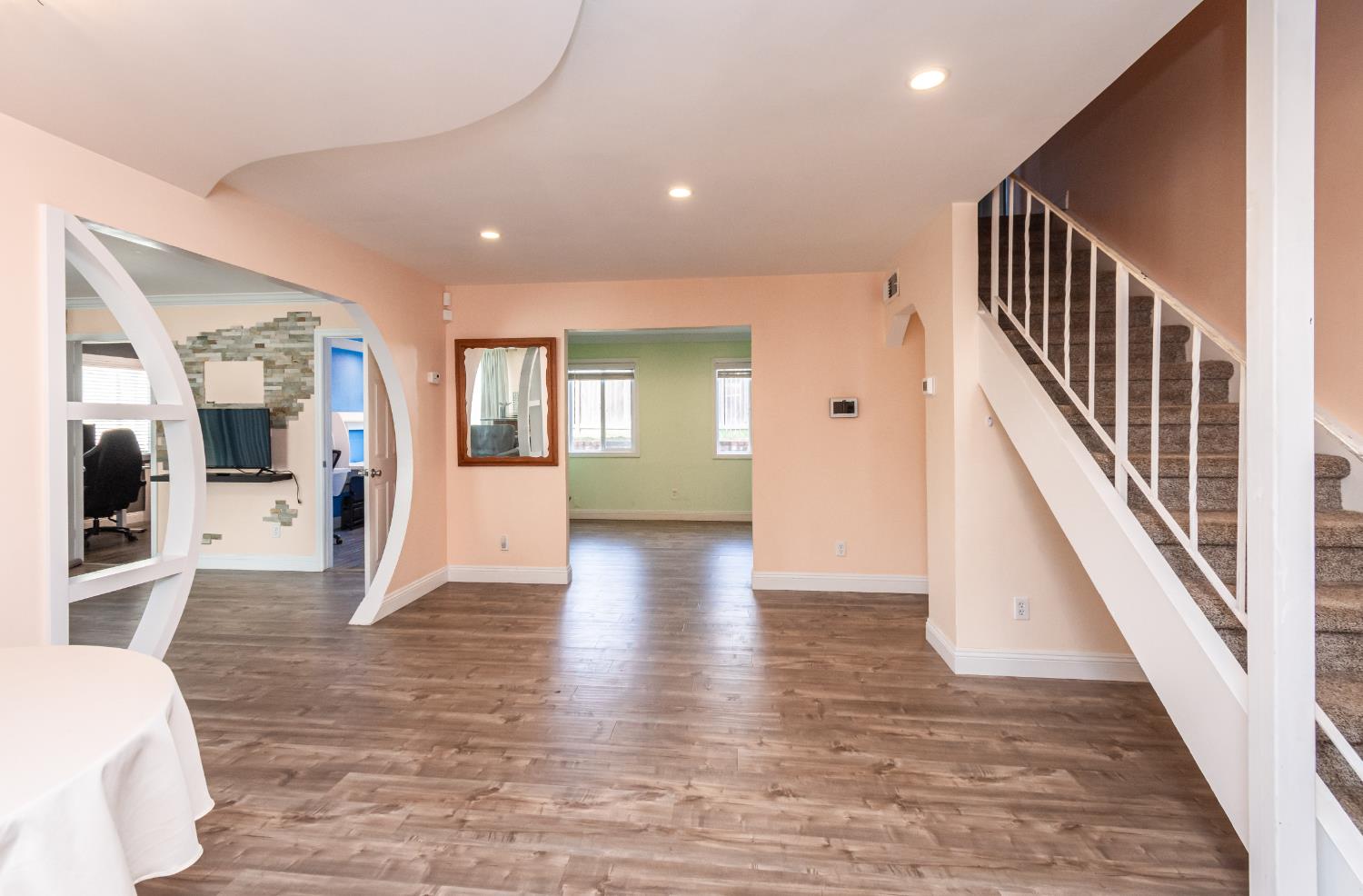 6851 Aleta Way Sacramento, CA 95842 - Photo 8 of 45 a view of a livingroom with wooden floor and stairs