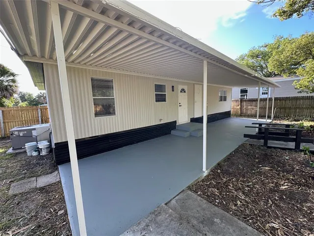 a house view with a backyard space