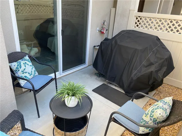 a blue vase with flowers sitting on a table