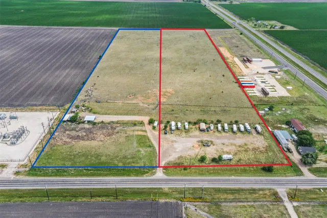 a view of swimming pool with a yard and large trees