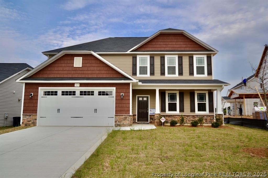5219 Riva Ridge Lane Hope Mills, NC 28348 - Photo 1 of 27 a front view of a house with a yard