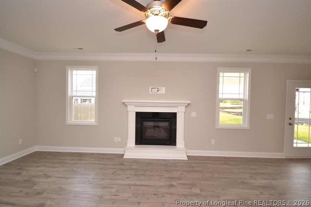 5219 Riva Ridge Lane Hope Mills, NC 28348 - Photo 12 of 27 a view of an empty room with window and a fireplace