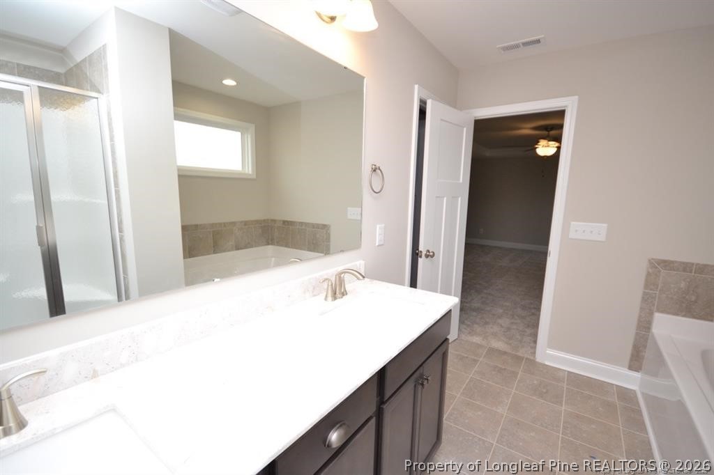 5219 Riva Ridge Lane Hope Mills, NC 28348 - Photo 15 of 27 a bathroom with a sink and mirror