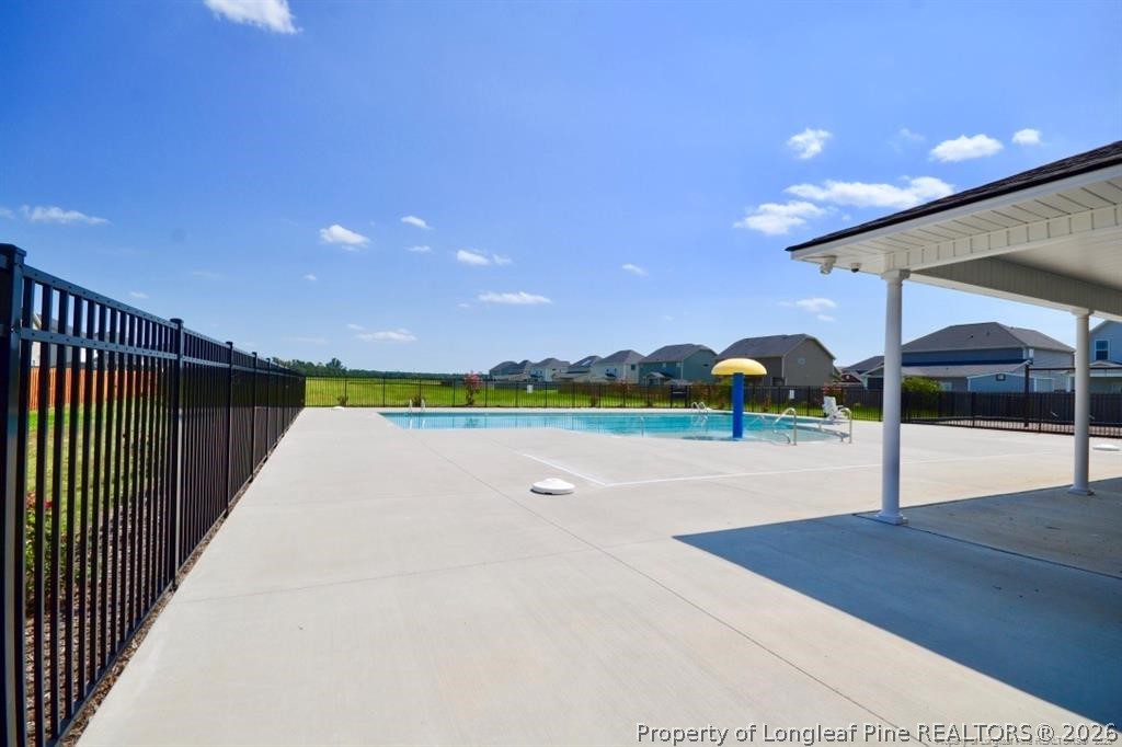 5219 Riva Ridge Lane Hope Mills, NC 28348 - Photo 25 of 27 a view of swimming pool with outdoor seating