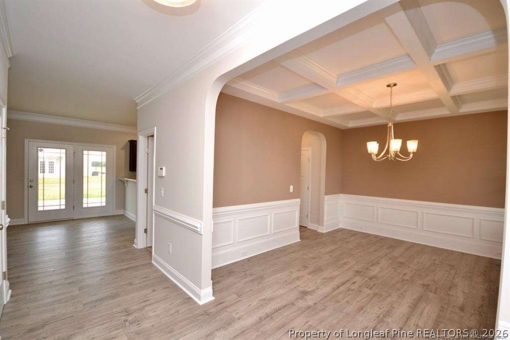 5219 Riva Ridge Lane Hope Mills, NC 28348 - Photo 4 of 27 a view of an empty room with window and wooden floor