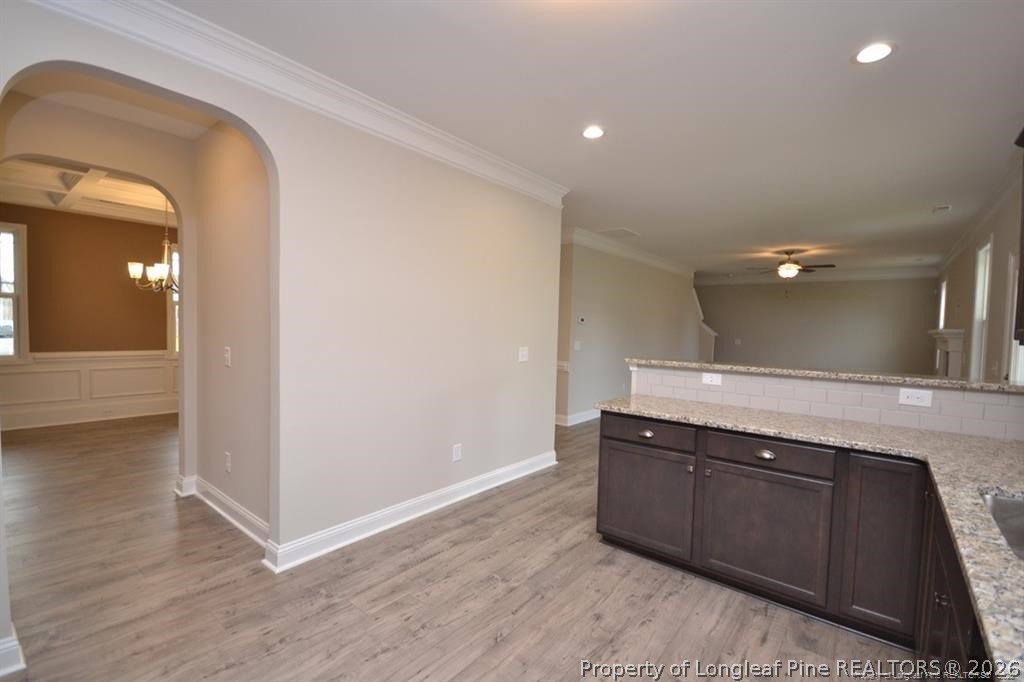 5219 Riva Ridge Lane Hope Mills, NC 28348 - Photo 8 of 27 a view of a hallway with wooden floor