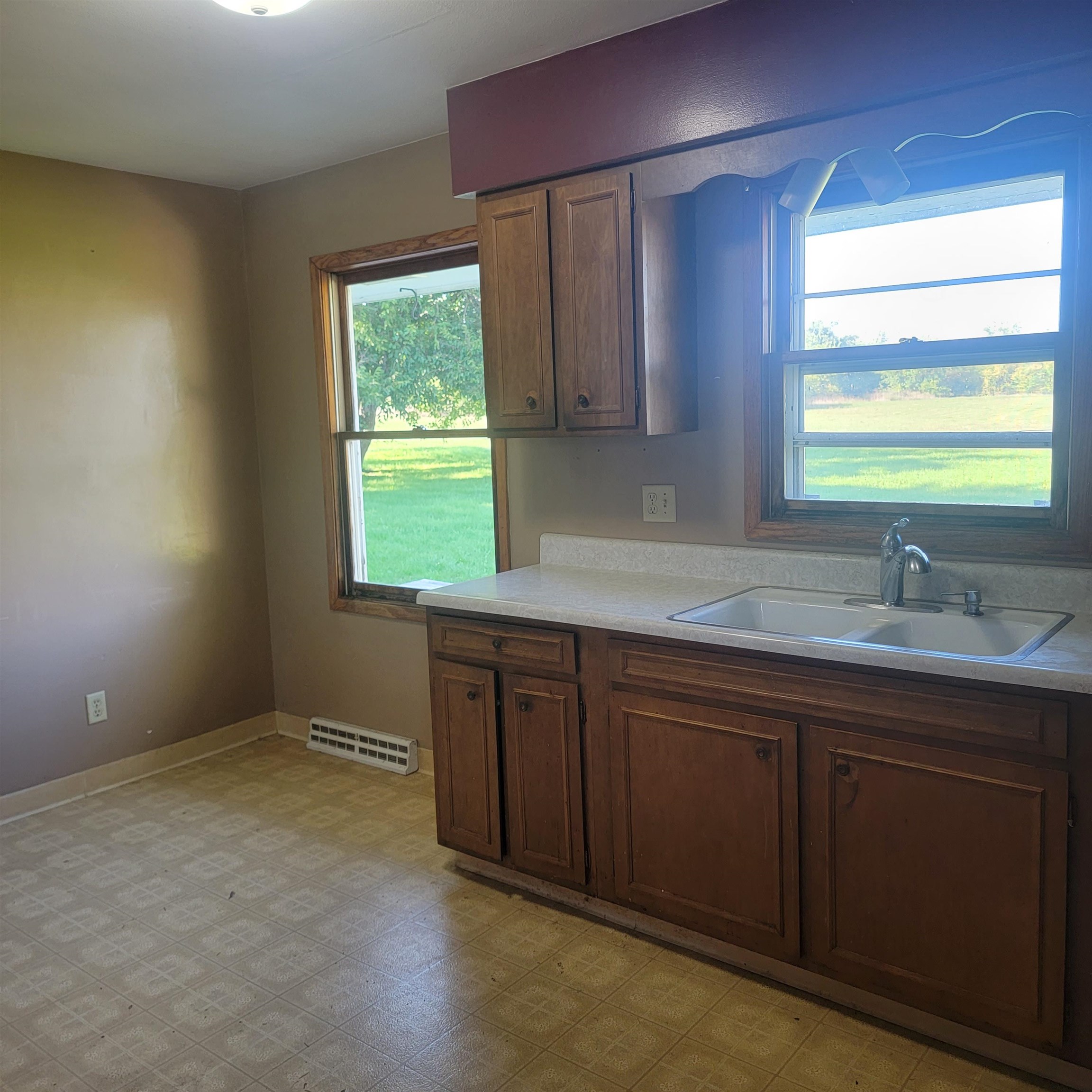 6641 Halley Road Rockford, IL 61101 - Photo 8 of 13 a kitchen with a sink window and cabinets