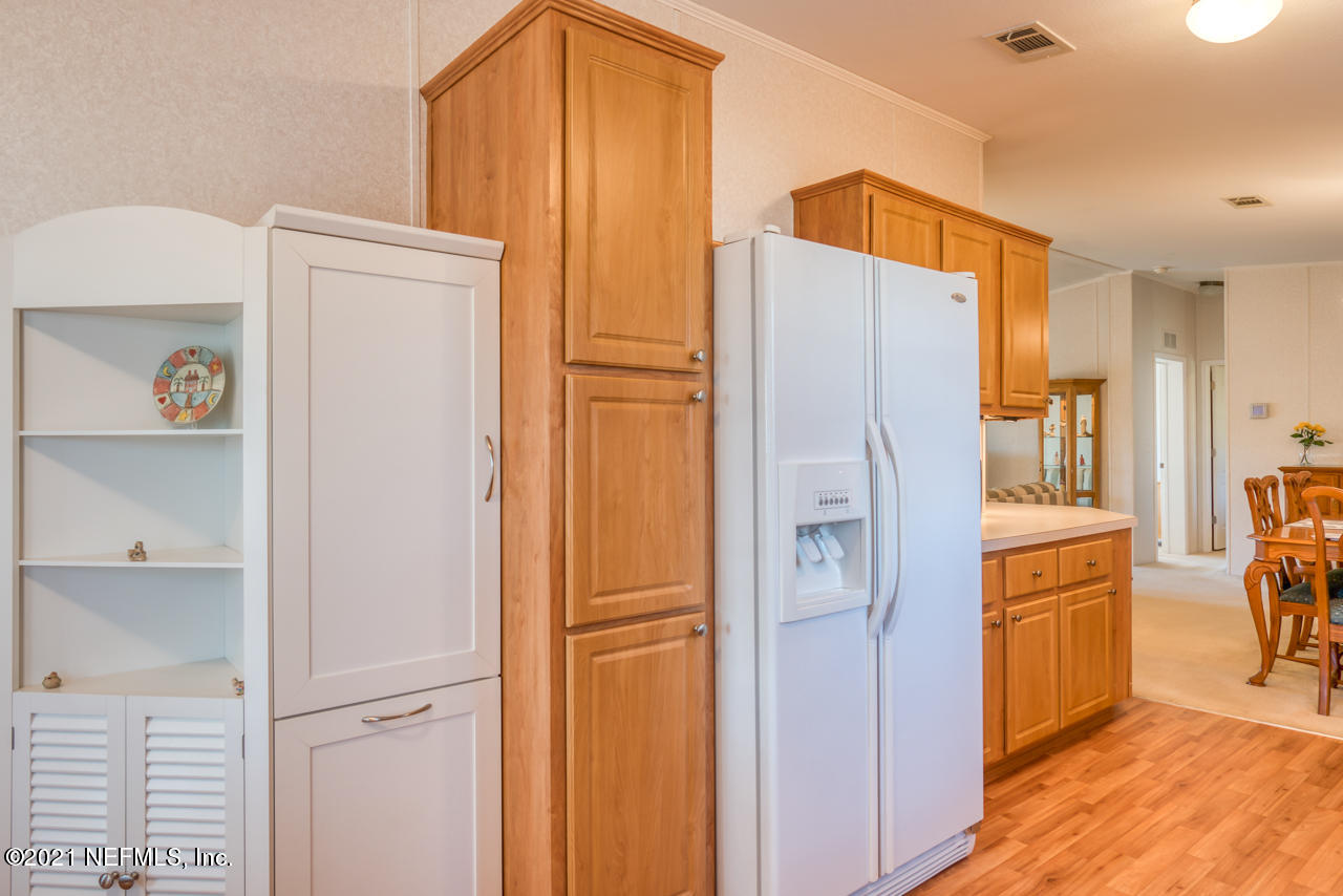 279 Pizarro Road St. Augustine, FL 32080 - Photo 14 of 34 a walk in closet with wooden floor