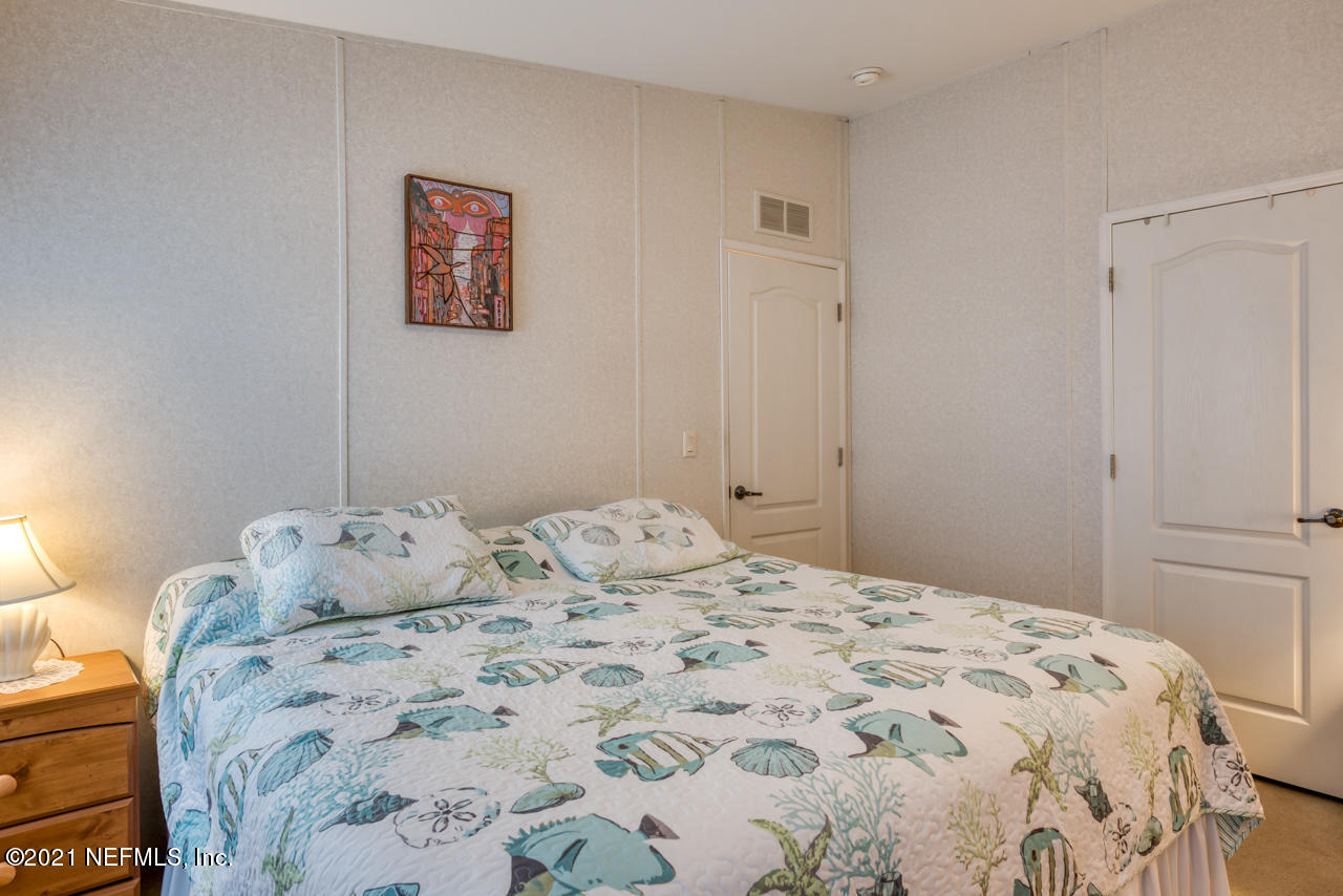 279 Pizarro Road St. Augustine, FL 32080 - Photo 20 of 34 a bedroom with a bed and a window