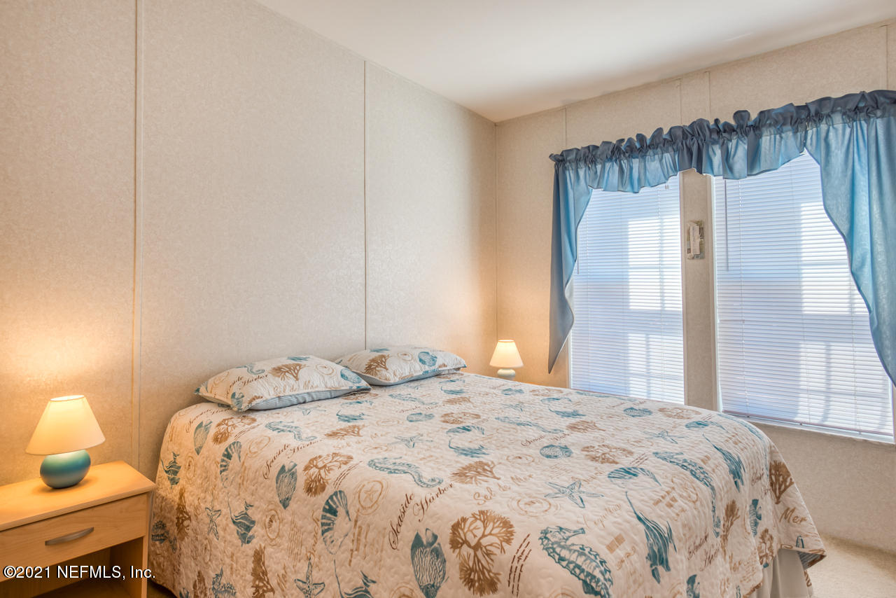 279 Pizarro Road St. Augustine, FL 32080 - Photo 23 of 34 a bedroom with a bed and a window
