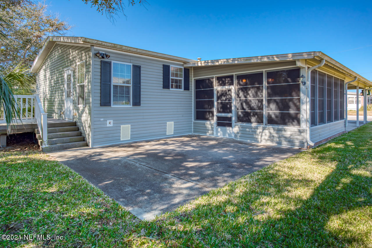 279 Pizarro Road St. Augustine, FL 32080 - Photo 7 of 34 a front view of a house with garden