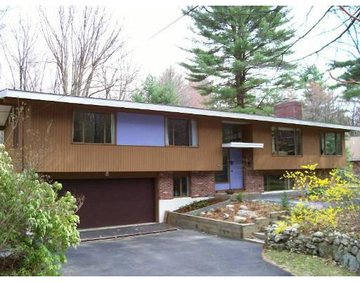 21 Turning Mill Road Lexington, MA 02420 - Photo 1 of 9 a front view of a house with a yard