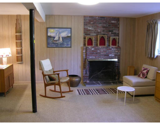 21 Turning Mill Road Lexington, MA 02420 - Photo 6 of 9 a living room with furniture and a fireplace