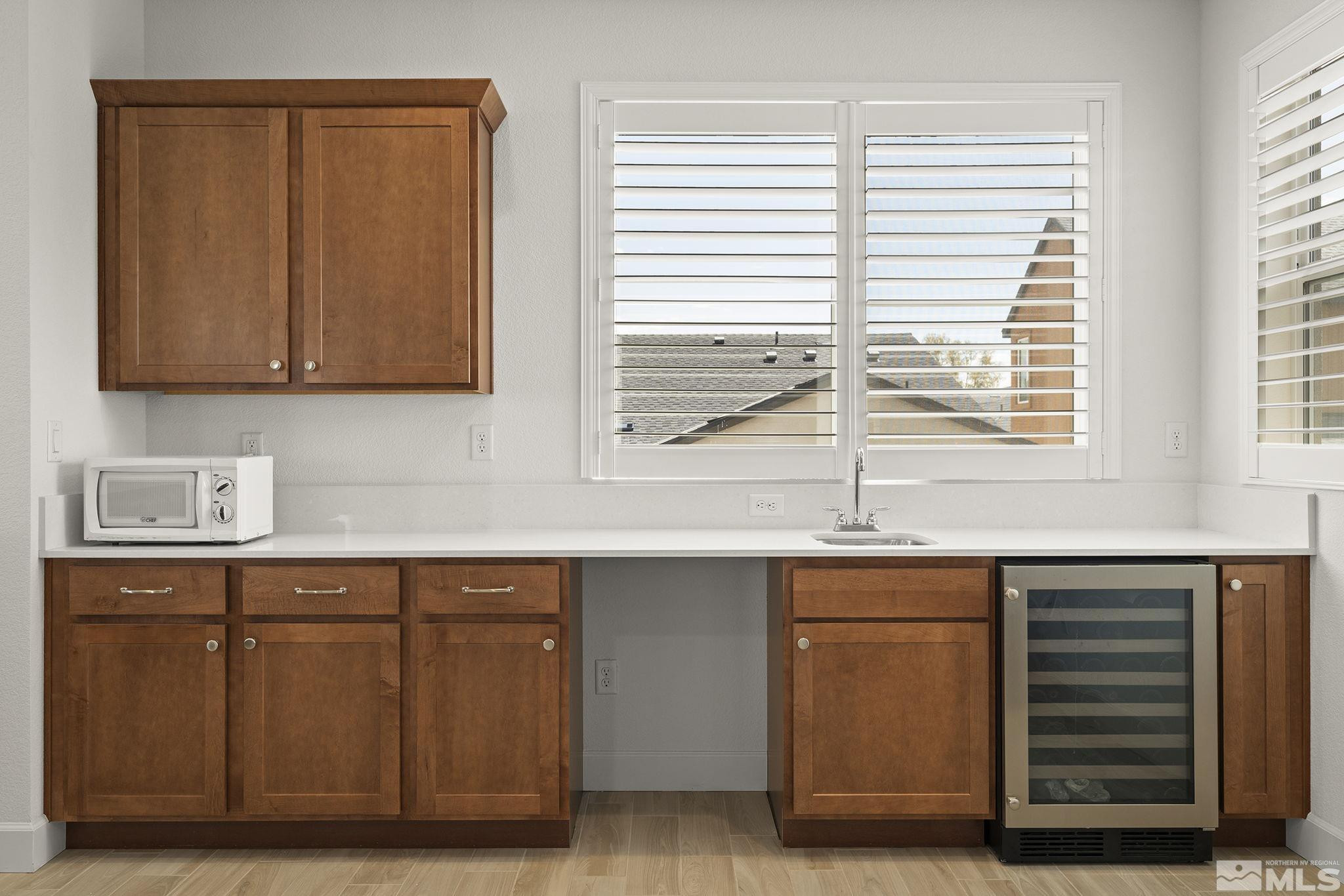606 Braided Rope Drive Reno, NV 89511 - Photo 24 of 39 a kitchen with a sink cabinets and a window