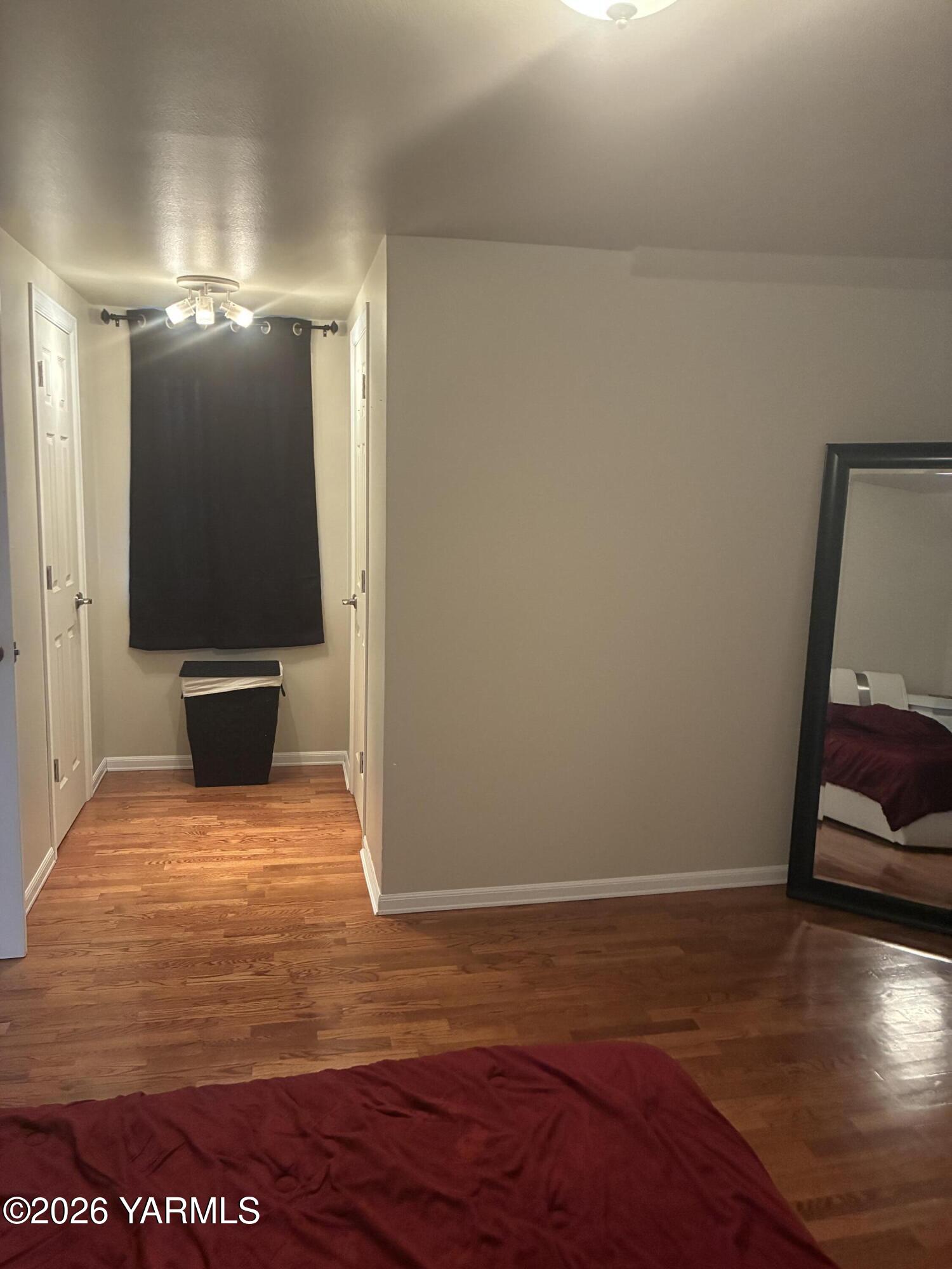 303 Ave G Grandview, WA 98930 - Photo 16 of 23 a view of room with wooden floor