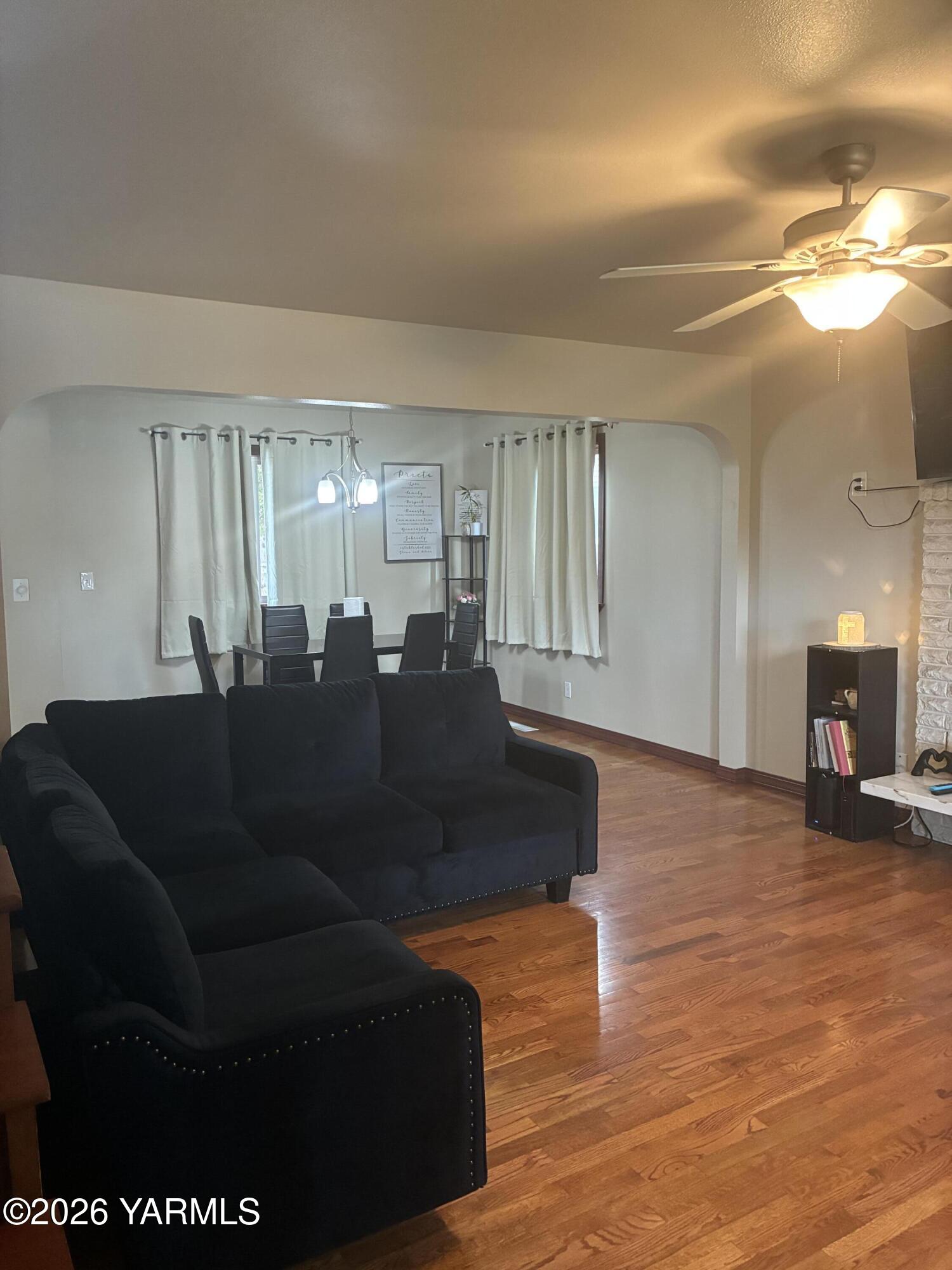 303 Ave G Grandview, WA 98930 - Photo 2 of 23 a living room with furniture and a large window