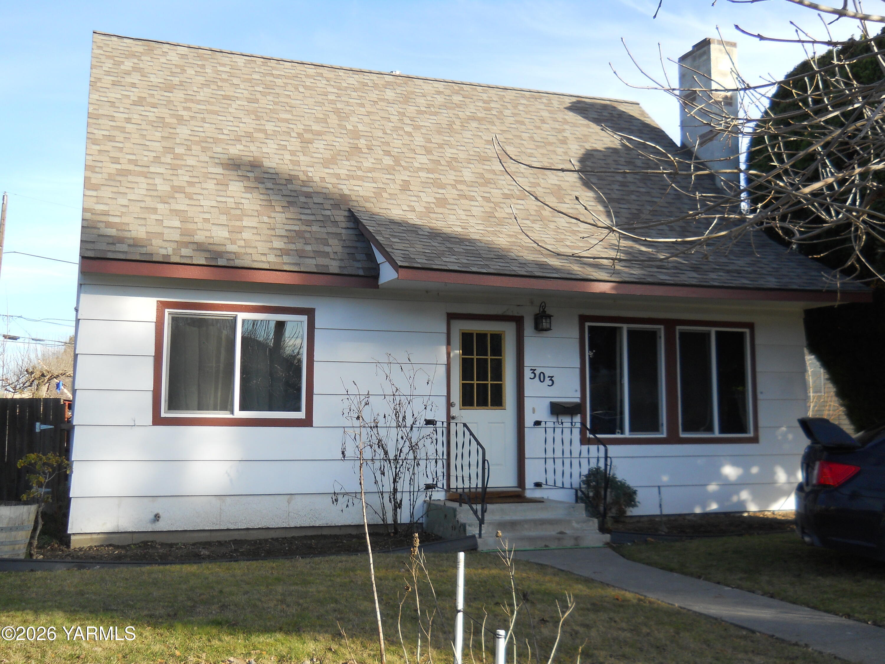 303 Ave G Grandview, WA 98930 - Photo 22 of 23 a front view of a house with lake view