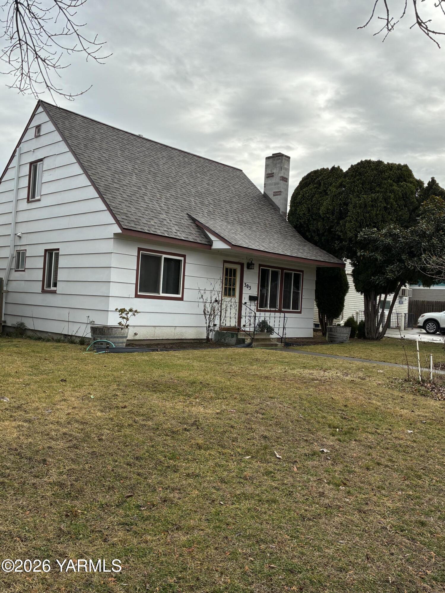 303 Ave G Grandview, WA 98930 - Photo 23 of 23 a front view of a house with swimming pool having outdoor seating