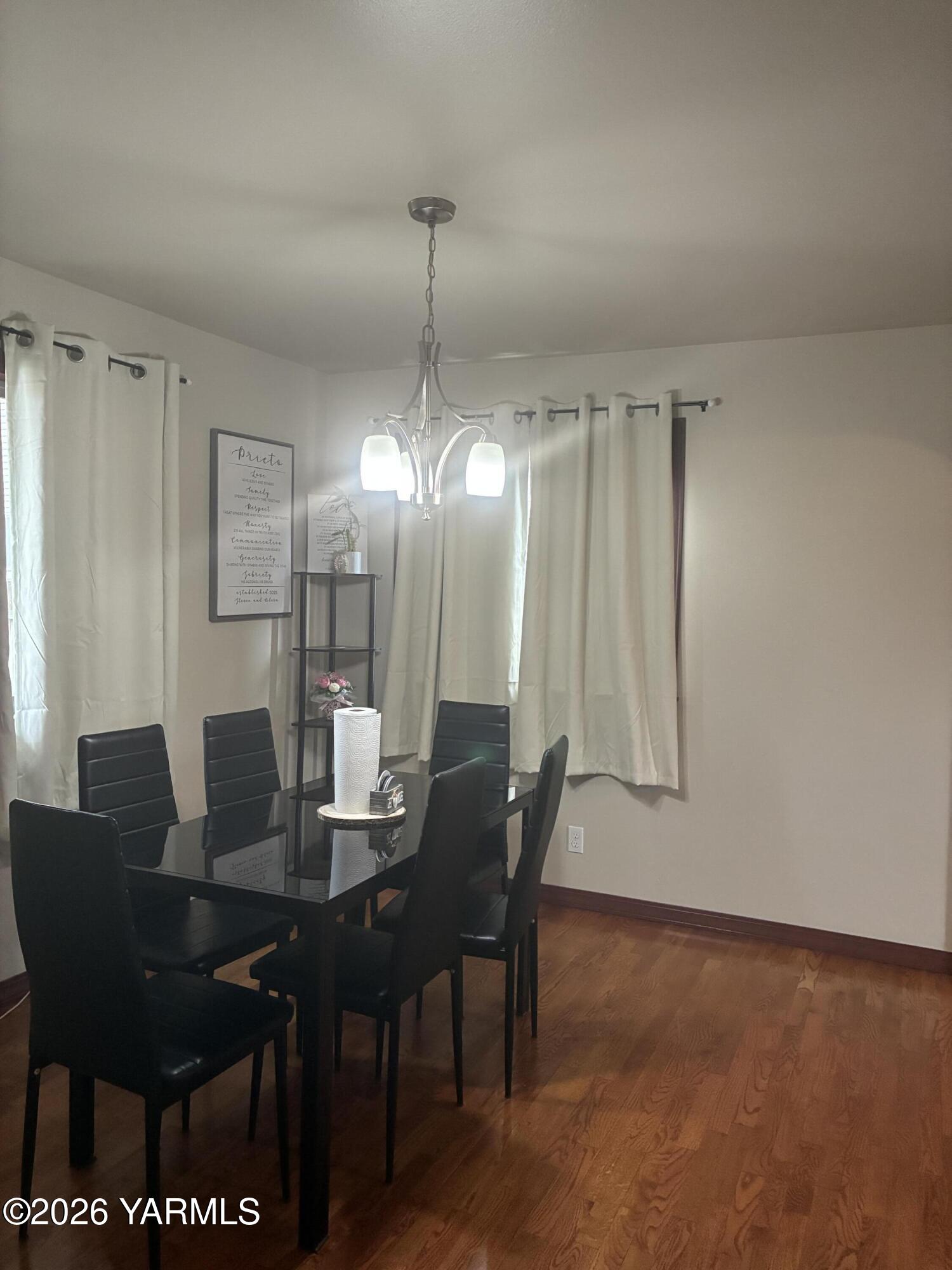 303 Ave G Grandview, WA 98930 - Photo 5 of 23 a view of a dining room with furniture
