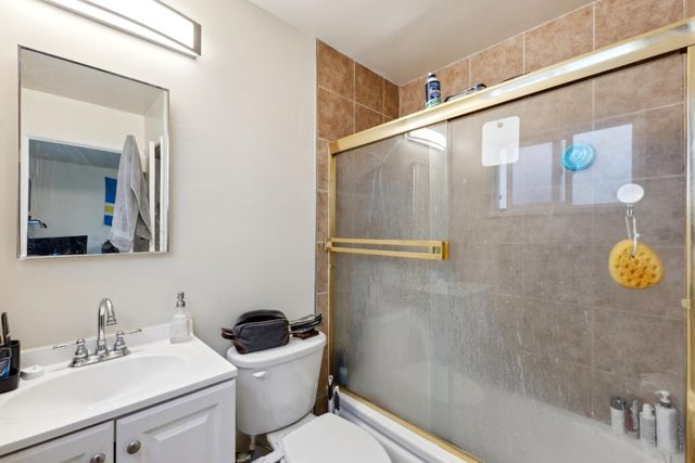 a view of a workspace with furniture and wooden floor