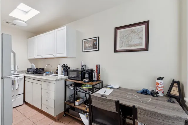 a kitchen with stainless steel appliances granite countertop a stove and a refrigerator