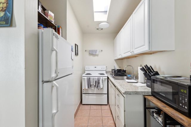 a view of a workspace with furniture